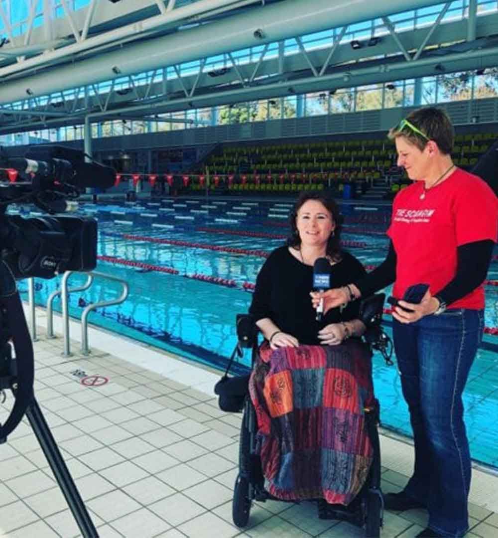 Scuba Gym diver with multiple sclerosis Megan Healey with Lyndi Leggett interviewed for local TV